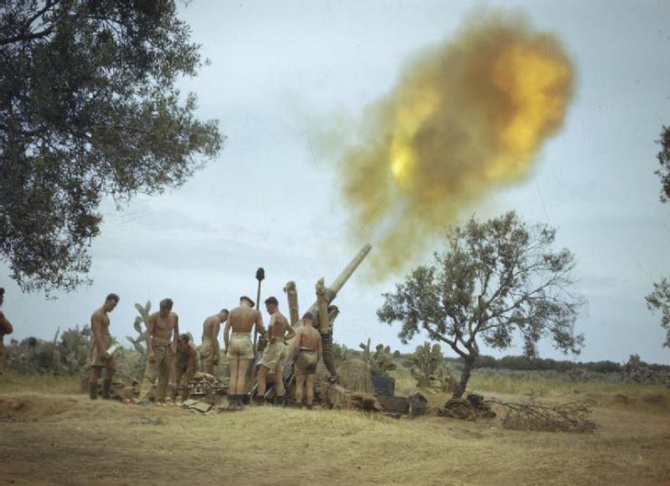 A British 4.5 inch medium gun firing on targets spotted by the RAF