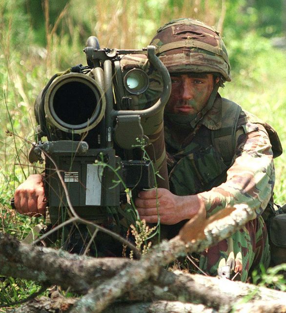 A British Royal Marine from 45 Commando watches for enemy tanks and armored personnel carriers from behind his anti-armor weapon.