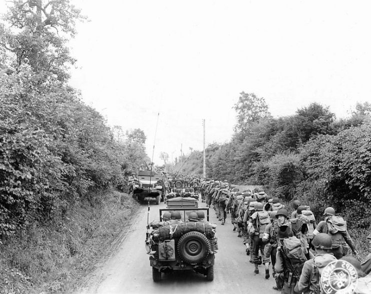 American soldiers and jeeps on their way to the front, Saint Lo, June 1944.