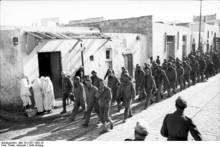 U.S. troops taken prisoner during the battle march through a Tunisian village.Photo: Bundesarchiv, Bild 101I-557-1002-10 / Pirath, Helmuth / CC-BY-SA 3.0