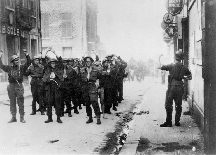 Canadian prisoners being led away through Dieppe after the raid.