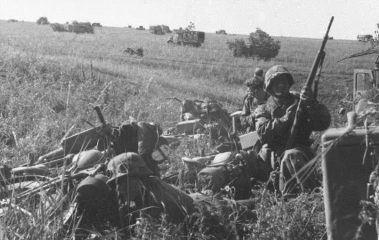 German motorized troops prepare to move out.