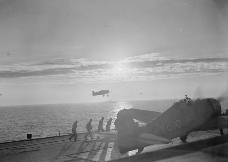 Grumman Hellcats of 1840 Squadron, Fleet Air Arm returning to HMS FURIOUS in Arctic waters after the strike against the TIRPITZ and other enemy shipping during Operation Mascot on 17 July 1944.