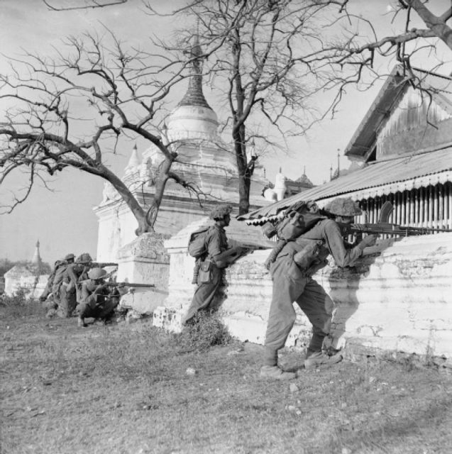 Campaign in Burma: Indian troops of 19th Division open fire on a Japanese strongpoint.