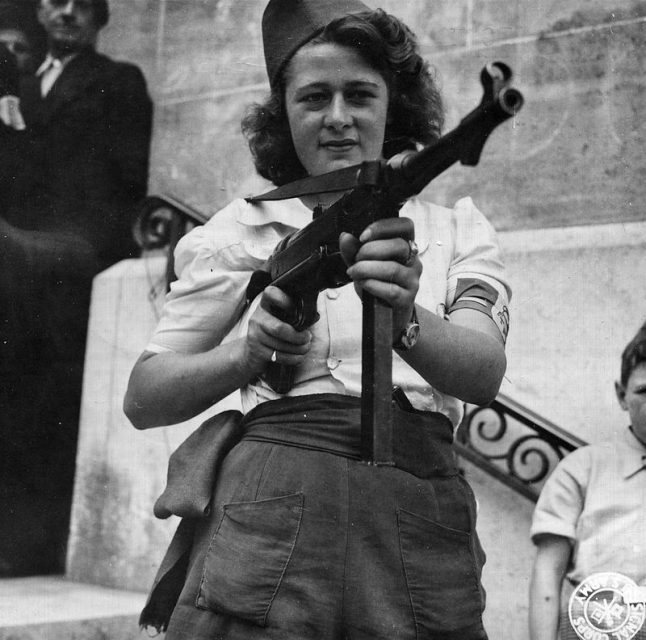 Simone Segouin, a French Partisan, poses with a German MP 40.