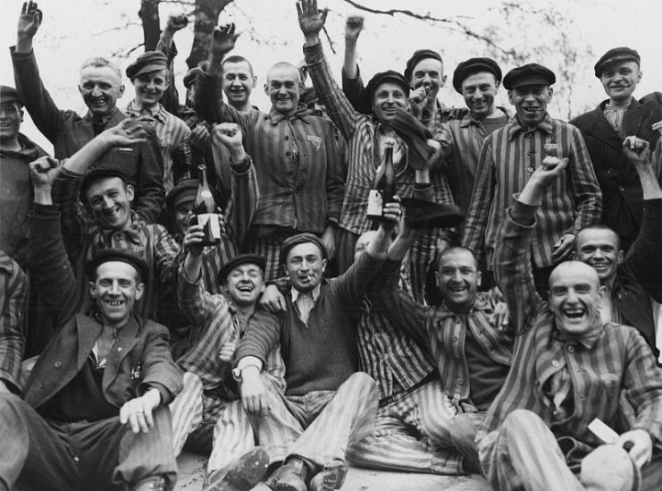 Polish prisoners in Dachau toast their liberation from the camp. Poles constituted the largest ethnic group in the camp during the war, followed by Russians, French, Yugoslavs, Jews, and Czechs.