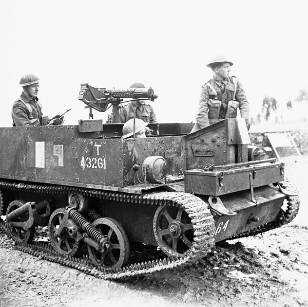 Unidentified personnel of the Saskatoon Light Infantry (M.G.) in a Universal Carrier equipped with a Vickers machine gun, Italy