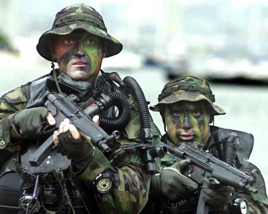 U.S. Navy SEALs armed with MP5-Ns on a training exercise.