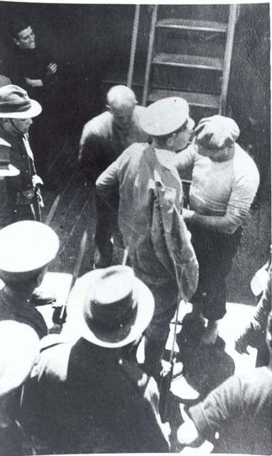 Felix von Luckner being searched after his recapture by the Iris.