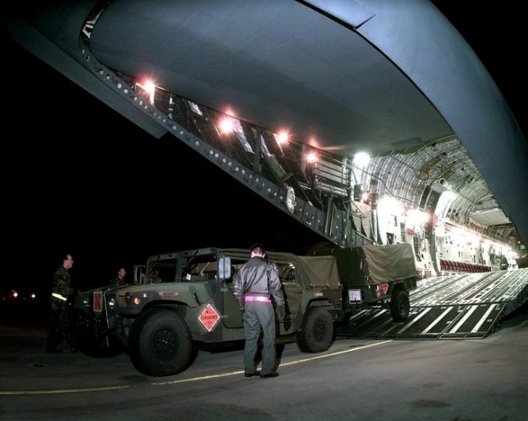 A 437th Civil Engineer Squadron explosive ordnance disposal team Humvee and trailer are backed onto the cargo ramp of a C-17A Globemaster III at Charleston Air Force Base, S.C.