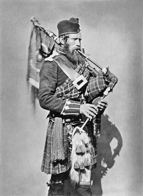Portrait of Pipe Major John Macdonald, 72 Highlanders, with bagpipes.
