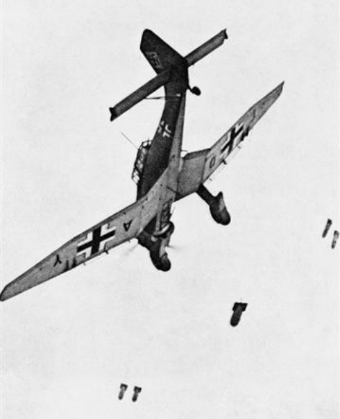 A German Junkers Ju 87B Stuka dropping bombs.