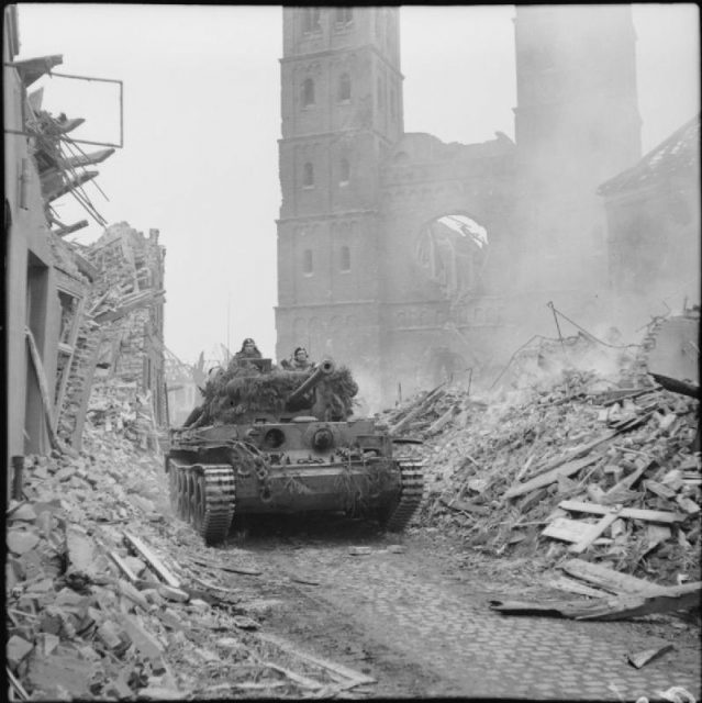 A King’s Royal Hussars Cromwell of the 11th armoured division advances through Uedem, Germany, 28 February 1945
