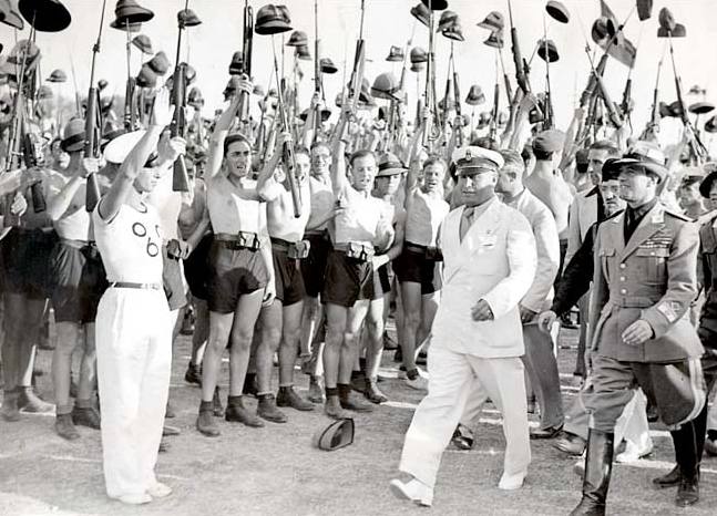 Benito Mussolini and Fascist Blackshirt youths in 1935.