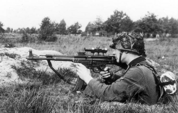 The Sturmgewehr 44 Assault rifle. A soldier demonstrates the transitional MP 43/1 variant. By Bundesarchiv – CC BY-SA 3.0 de