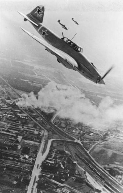 Three Russian aircraft Ilyushin Il-2 “Strumovik over Berlin during the Battle of Berlin.