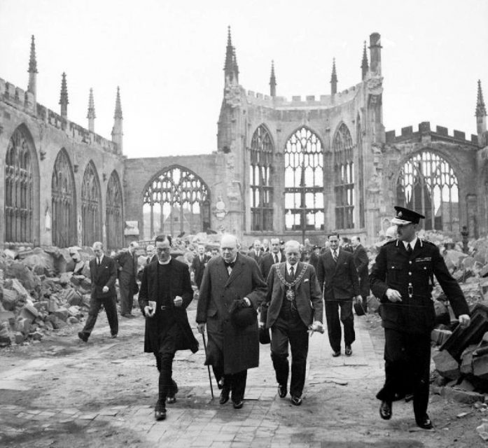 Churchill walks through the ruins of Coventry Cathedral with Alfred Robert Grindlay, 1941