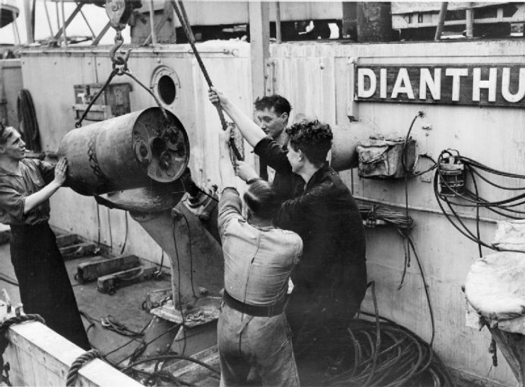Depth charge being loaded aboard the corvette HMS Dianthus at Londonderry on August 14, 1942.