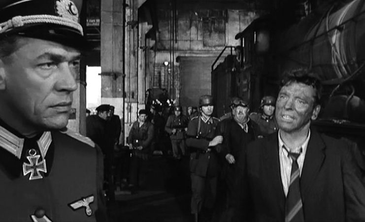 L. to R. : Paul Scofield, Michel Simon (background) & Burt Lancaster in The Train – trailer