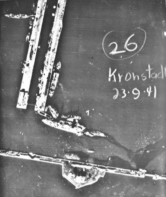 Luftwaffe aerial photograph of the damaged Soviet battleship Marat in Kronstadt, leaking oil