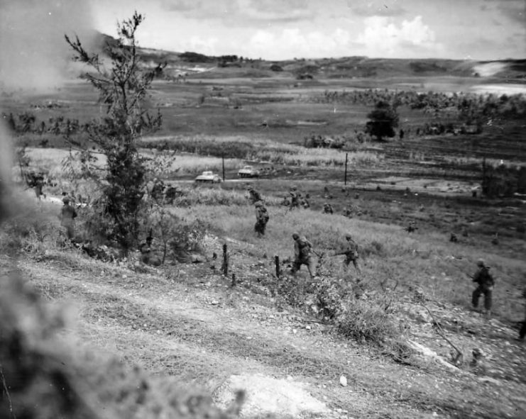 M4 Tanks Cover Marines Attacking Japanese Positions in Saipan, 1944.