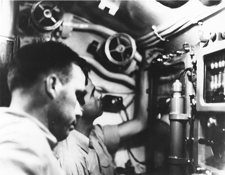 Morton (front) and O’Kane in the conning tower of Wahoo during an attack on a Japanese convoy off New Guinea, 26 January 1943