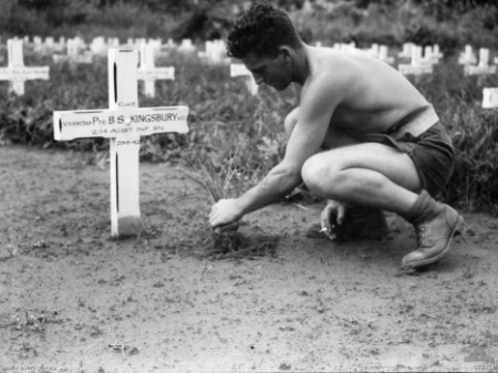 Signalman R. Williams tending to Kingsbury’s grave in 1944
