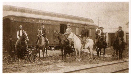 Posse organized to give chase to the Wild Bunch. From left to right: standing, unidentified; on horse, George Hiatt, Timothy Keliher, Joe Lefors, H. Davis, S. Funk, Thomas Jefferson Carr.