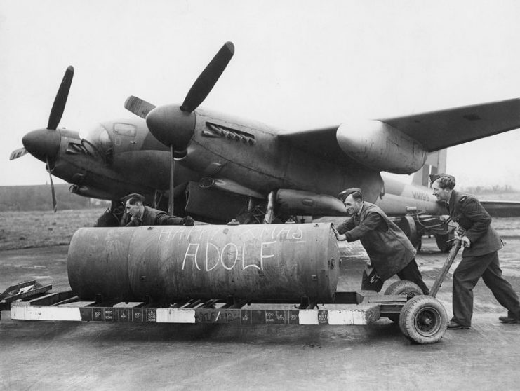 A 4,000 lb bomb being loaded onto a de Havilland Mosquito.