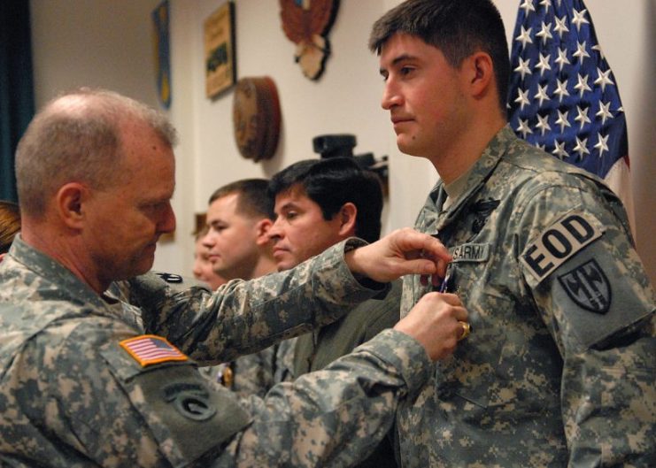 A soldier is awarded the Purple Heart during a ceremony on Coleman Barracks