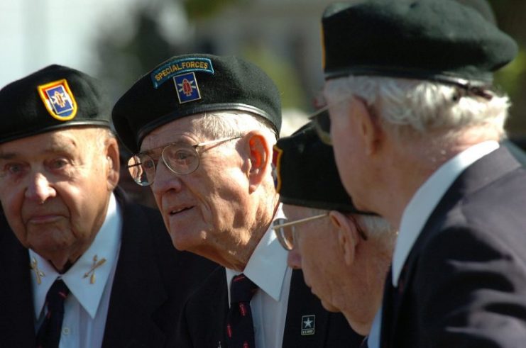 Mark Radcliffe (second from left) and other veterans of the First Special Service Force listen to Brigadier General Stan Putnam, Montana Army National Guard, speak during a memorial service in honor of their 60th reunion at Helena, Mt. on August 18th, 2006.