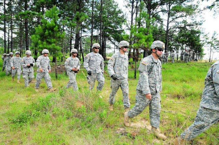 Citizen-Soldiers from the 1st Battalion, 296th Infantry Regiment of the Puerto Rico National Guard, make their way through the woods onto an M136 AT-4 rocket launcher familiarization training exercise June 6 during Annual Training 2015 at Fort Polk
