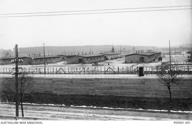 “Another view of the Gustrow camp taken from one of the raised machine gun (positions) houses. The little house in the middle right foreground, just inside the wire is a sentry-box.”