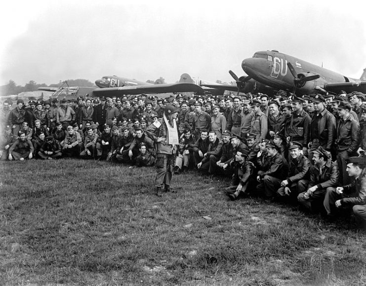 Brigadier General Anthony C. McAuliffe, artillery commander of the 101st Airborne Division, gives glider pilots last-minute instructions in England for Operation Market-Garden on September 18, 1944, before the take-off on D plus 1 of the operation.