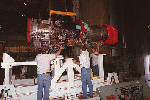 A General Electric F414 engine being installed on a test bed