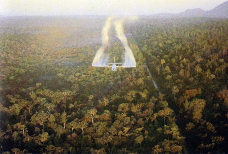 A U.S. Air Force Fairchild UC-123B Provider “Ranch Hand” aircraft spraying defoliant next to a road in South Vietnam in 1962. “Operation Ranch Hand”