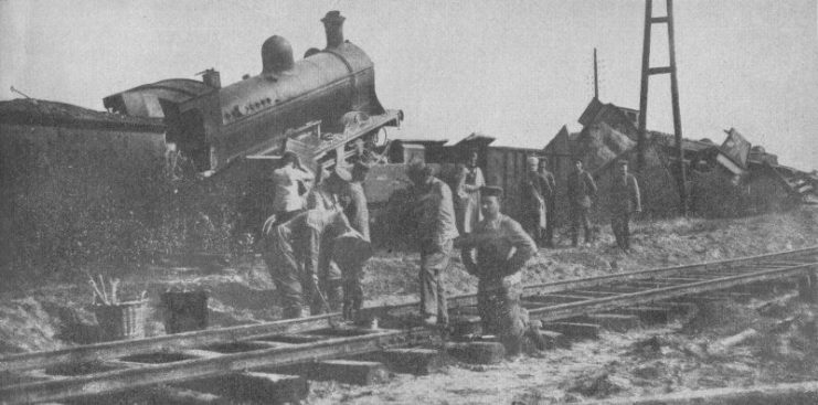 “Clearing away wrecked Belgian trains To hinder German operations, these trains were started in opposite directions on the road to Brussels, and permitted to collide. The surrender of the city to the Germans occurred on August 20, 1914