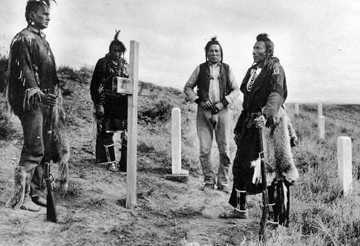 Crow Scouts visit Custer Battlefield about 1913. Left to right: White-Man-Runs-Him, Hairy Moccasin, Curley, Goes Ahead.