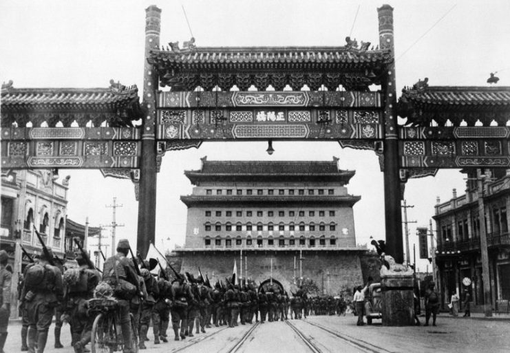 Japanese march into Zhengyangmen of Beijing after capturing the city in July 1937.