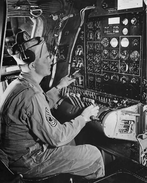 Flight Engineer at instrument panel aboard B-29 Superfortress