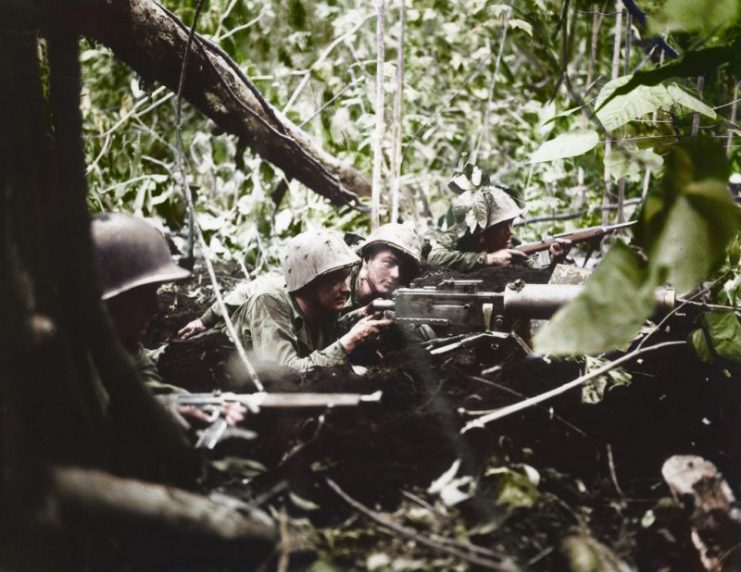 Four Marines defend a position during a Japanese counterattack. Photo: Cassowary Colorizations CC BY 2.0