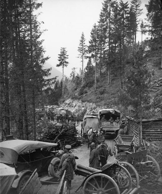 Italian and British troops passing abandoned Austro-Hungarian artillery on the Val d’Assa mountain road, 2 November 1918