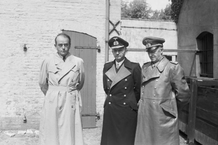 Members of the Flensburg Government after their arrest. Albert Speer (left), Dönitz (center) and Alfred Jodl (right).