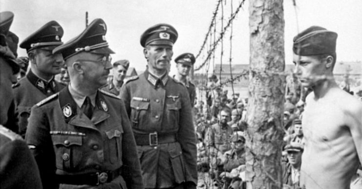 Heinrich Himmler visiting a Prisoner of War camp during World War 2. The prisoner is claimed by some to be British soldier, Horace Greasley.