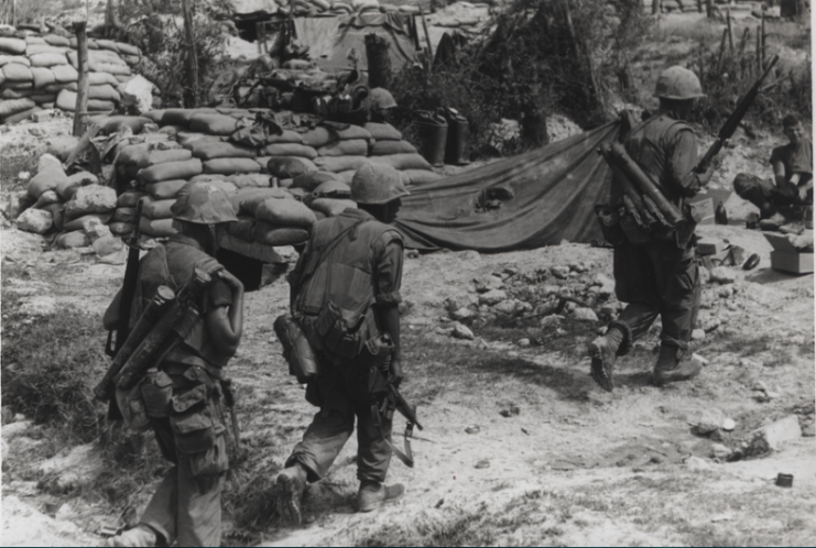 Coming In: A 4th Marine Regiment patrol enters its command post after conducting an early morning patrol along the Cau Viet River during Operation Napoleon/Saline. The area, 11 miles south of the demilitarized zone has been the scene of several sharp battles with North Vietnamese forces during the past month.Photo: USMC Archives CC BY 2.0