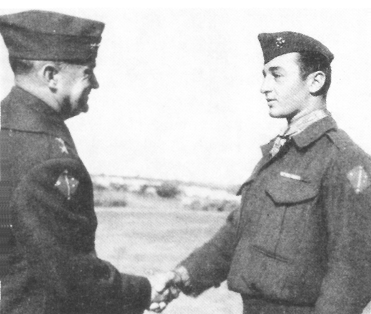 SGT MITCHELL PAIGE receives the Medal of Honor from Gen Vandegrift as a reward for outstanding heroism while manning a machine gun of the 2nd Battalion.