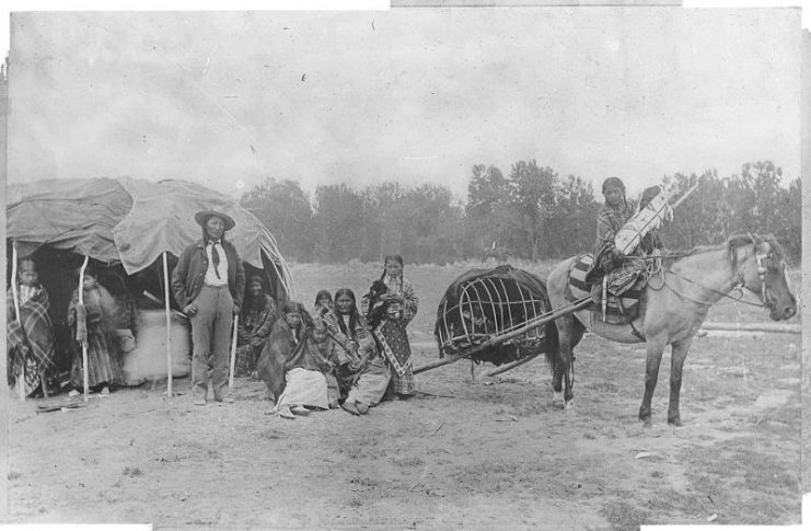 Plains Indians.Stump Horn and his family (Cheyenne) with a horse and travois, c. 1871–1907.