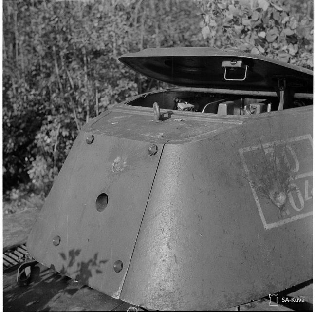 Two non-penetrating anti-tank gun hits on the right side and rear of the turret of a Red Army T-34 captured by the Finnish Army. Summer of 1941.
