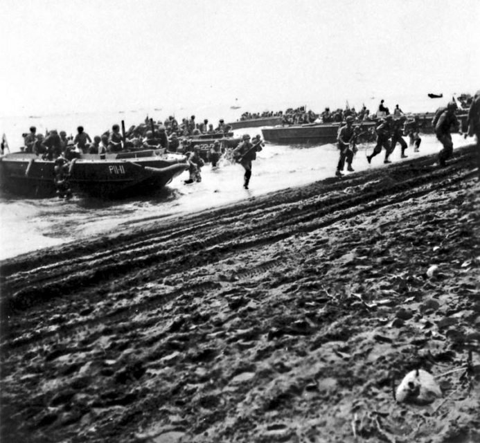 U.S. Marines debark from LCP(L)s onto Guadalcanal on August 7, 1942.