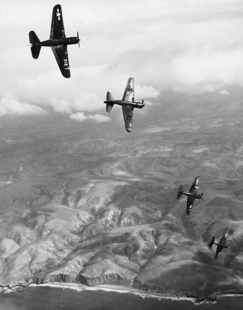 U.S. Navy Curtiss SB2C-5 Helldivers of Attack Squadron 1A (VA-1A) “Tophatters” roll into dives to support amphibious forces during postwar landing exercise (1947)